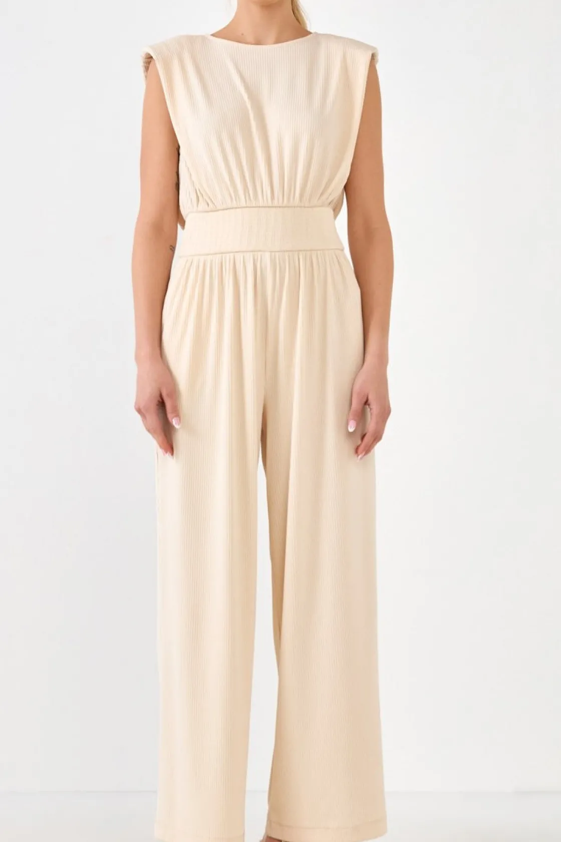 endless_rose__shoulder_pa_0.webp ENDLESS ROSE Tops | One Pieces*- Shoulder Pad Jumpsuit with Smocked Waist CREAM